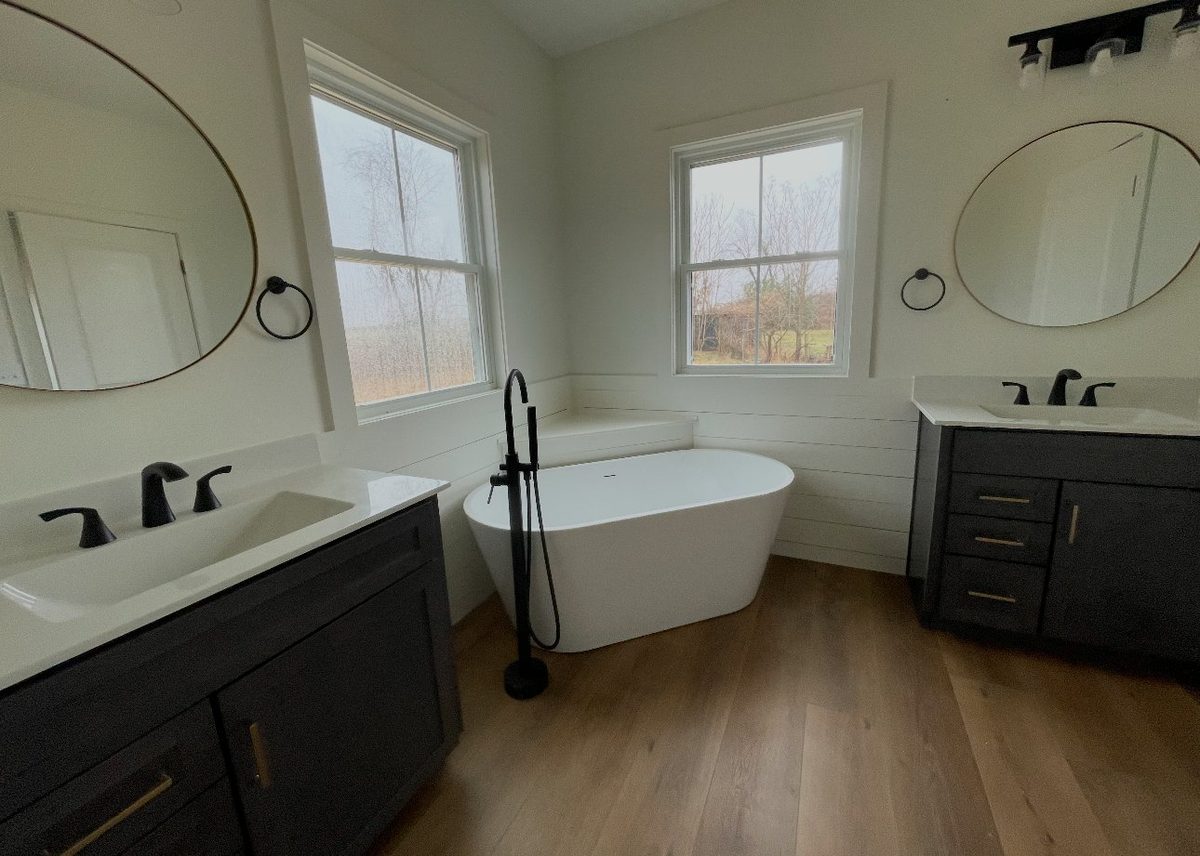 Master bathroom remodel with dual vanities freestanding tub and shiplap accent wall by Home Fix Pro in Purcellville VA