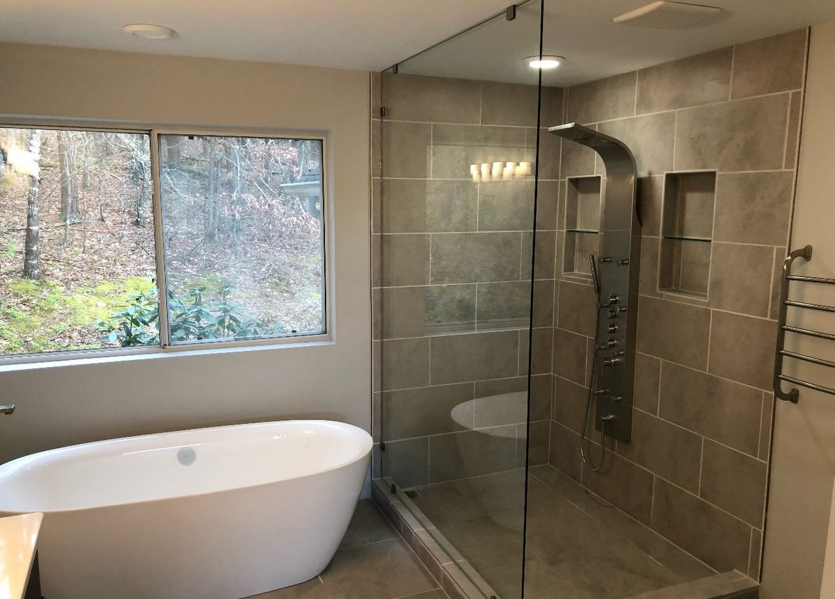 Master bathroom with freestanding tub and shower tower panel by Home Fix Pro in Purcellville VA